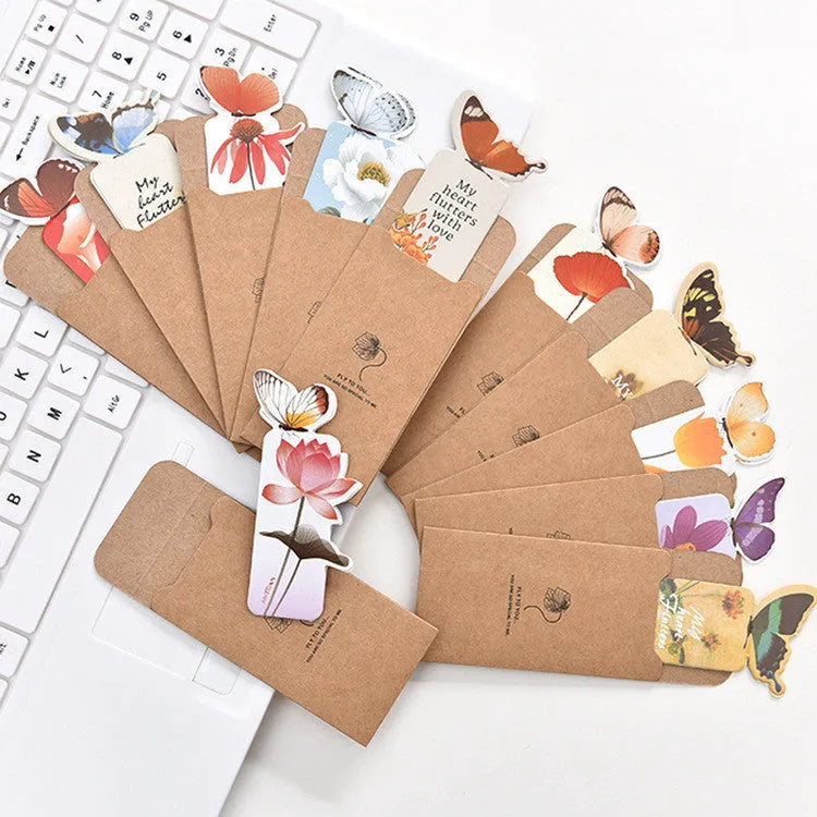 Set of butterfly design paper bookmarks on a white background, showing their 13.5cm length.