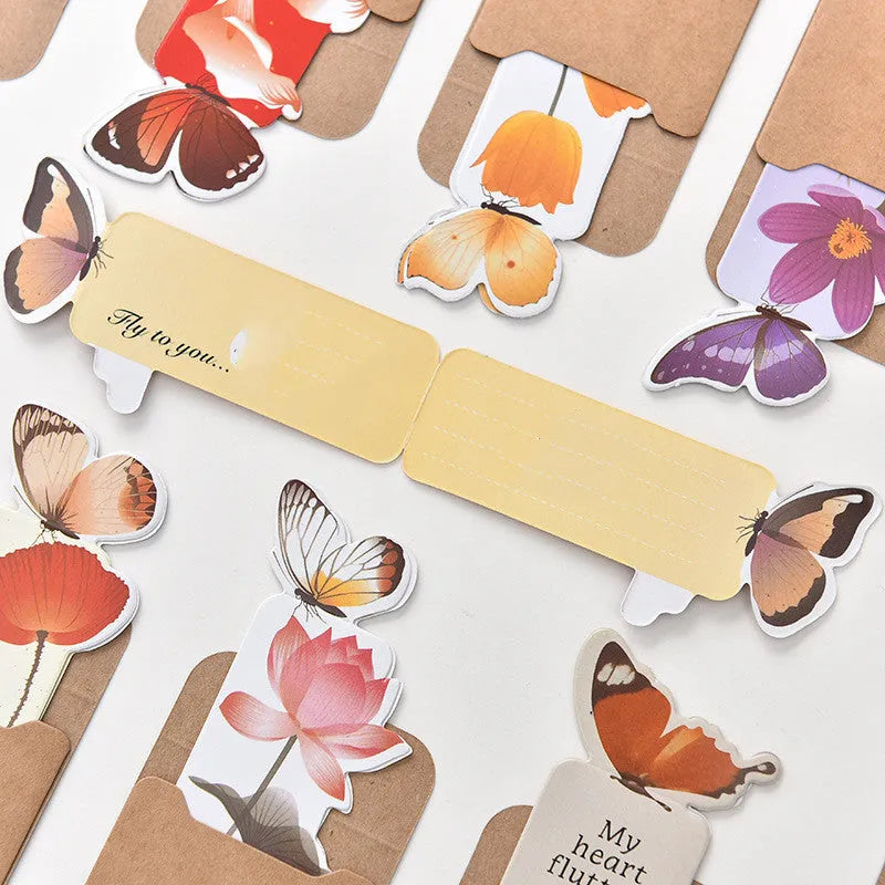 Set of butterfly design paper bookmarks on a white background, showing their 13.5cm length.
