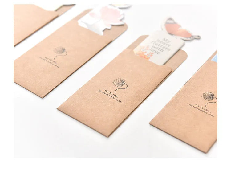 Set of butterfly design paper bookmarks on a white background, showing their 13.5cm length.