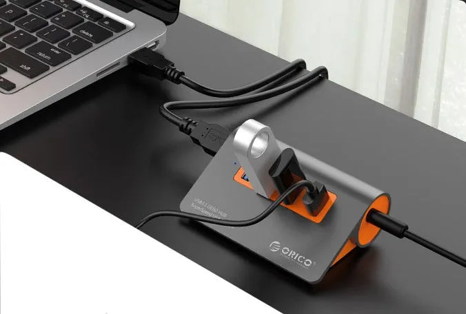Dark grey and orange aluminium USB 3.1 laptop hub with four ports and 100cm cable