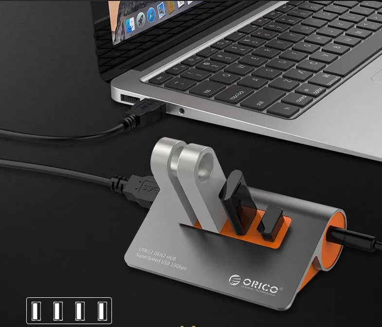 Dark grey and orange aluminium USB 3.1 laptop hub with four ports and 100cm cable
