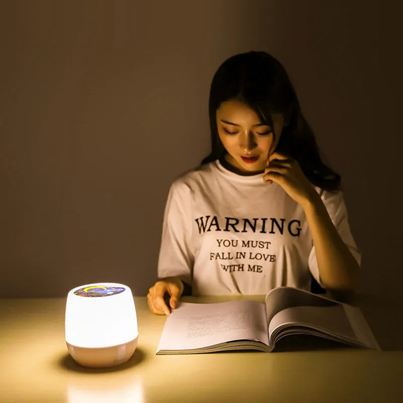 Projector night light displaying rotating star patterns on bedroom ceiling with remote control
