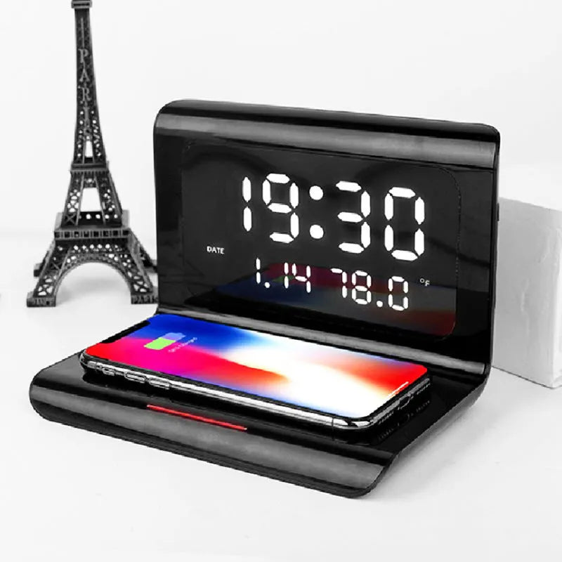 White or black wireless charger alarm clock with digital display showing time temperature humidity and 10W charging status