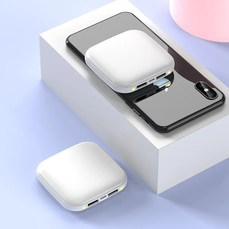 20000 mAh mini power bank with LED flashlight in plastic case showing black, blue, pink, white colour options
