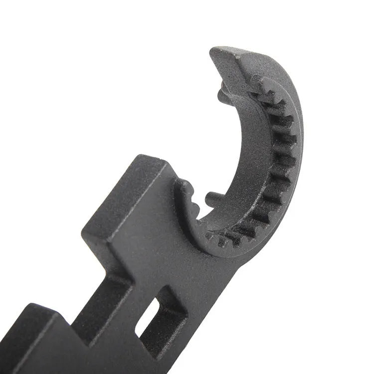 Black all-steel combination wrench for AR15 M4 maintenance on a neutral background.