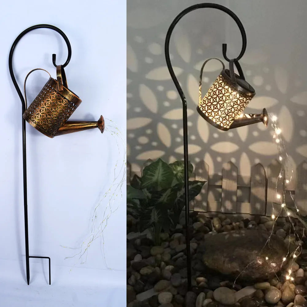 Solar watering can garden lamp with hollow-out iron shower body and 36 warm white LED lights on copper wire, installed in grass