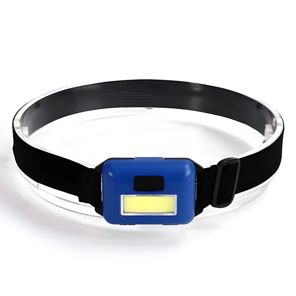 Black, blue, and red mini LED headlight with headband, shown with AAA batteries for scale.