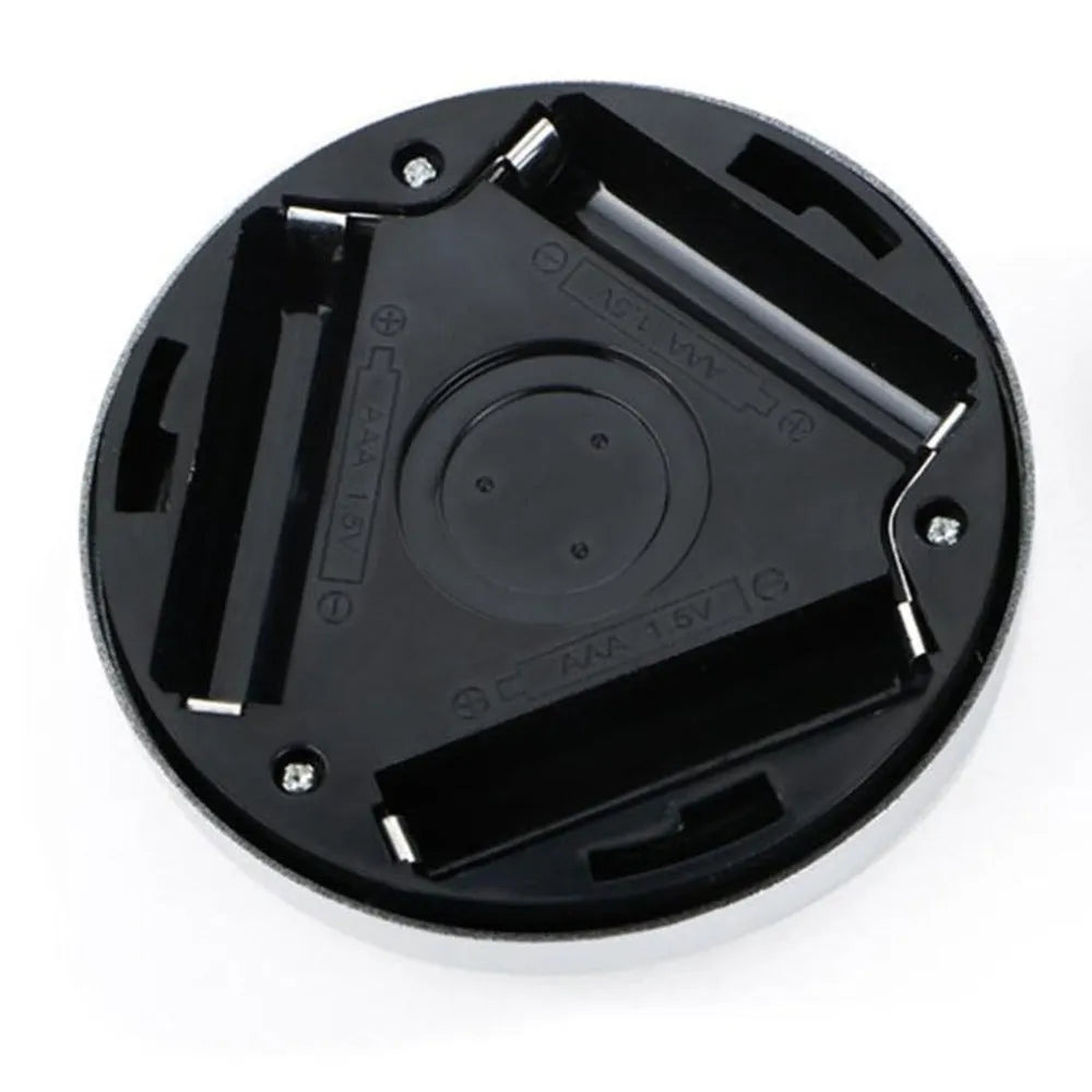 Silver square wireless motion sensor night light with compact 80mm design on a surface.