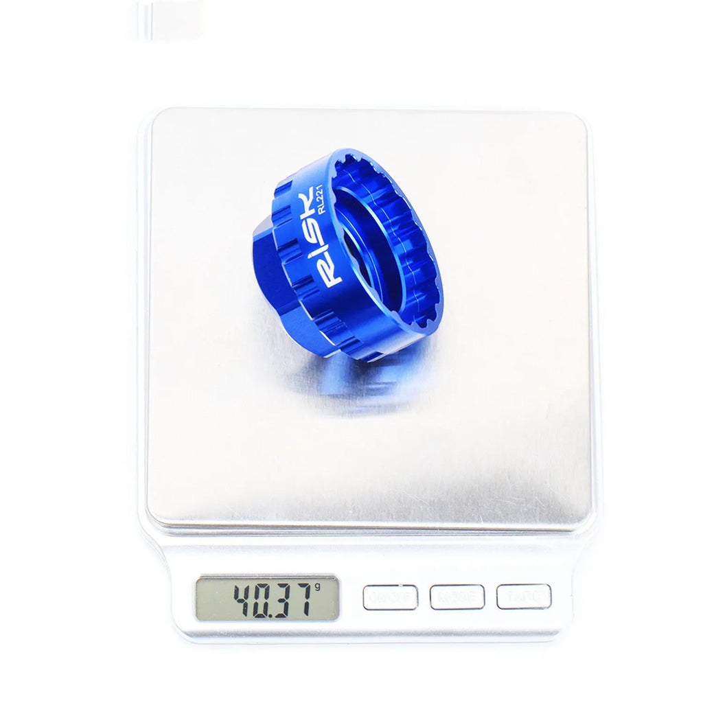 Blue aluminium bicycle chainring removal tool for Shimano 12-speed direct mount cranksets.
