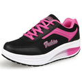 Women's heelless sports shoes in a mid-heel design, shown in a choice of colours including black and pink.