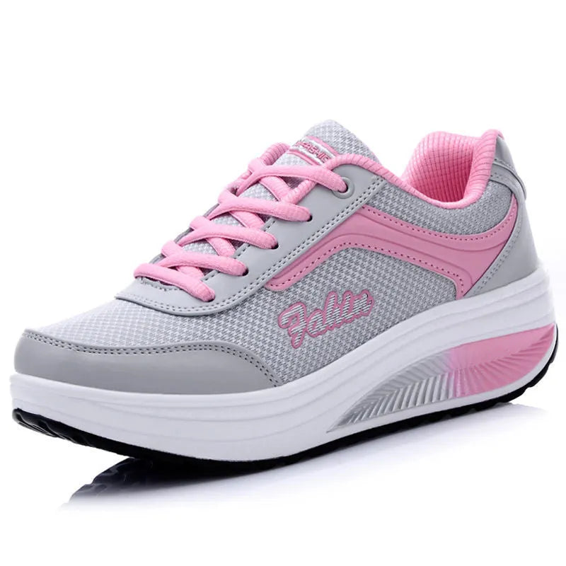 Women's heelless sports shoes in a mid-heel design, shown in a choice of colours including black and pink.