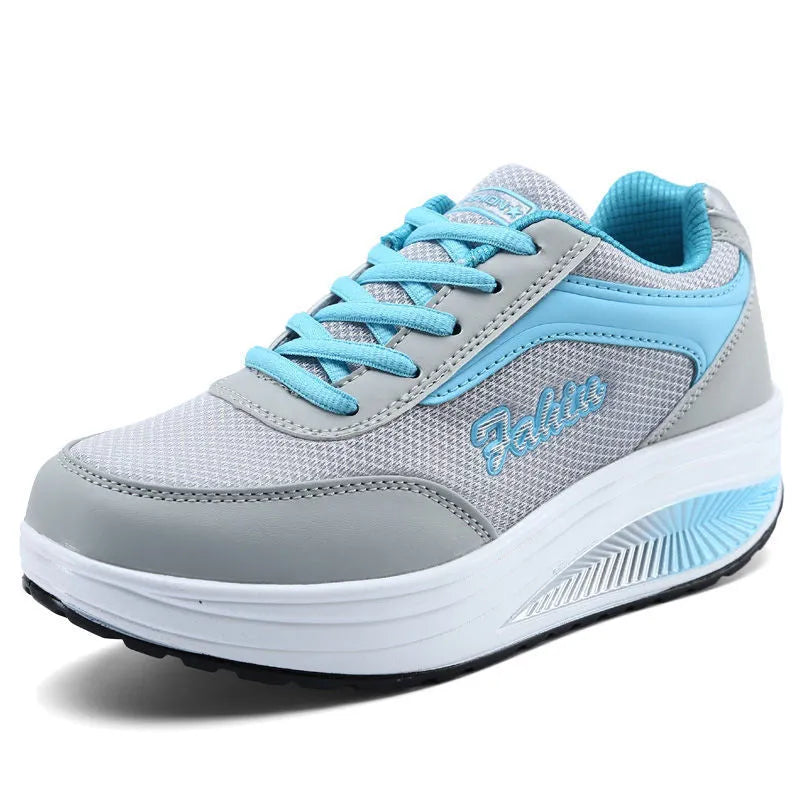 Women's heelless sports shoes in a mid-heel design, shown in a choice of colours including black and pink.