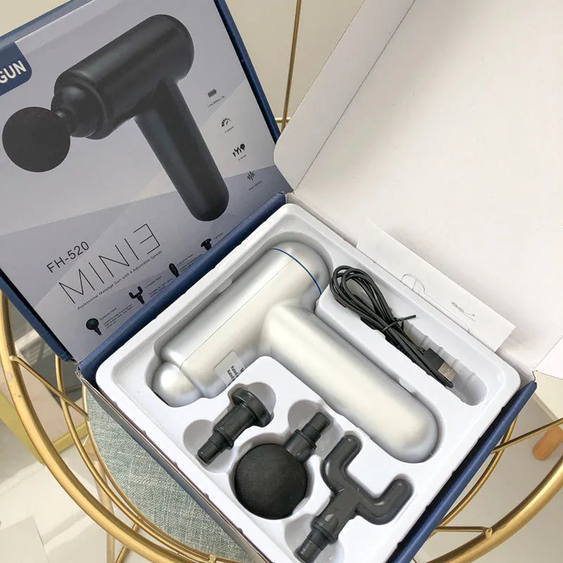 Black fascia gun massager with USB charging port shown alongside red and white colour variants