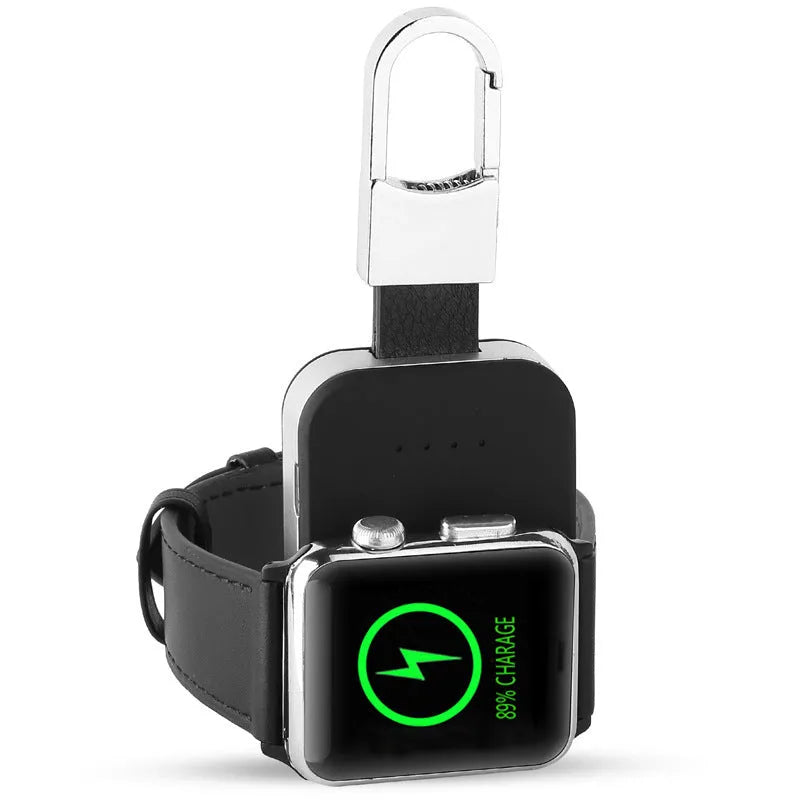 Black Apple Watch portable wireless charger keychain with keyring, shown next to an Apple Watch.
