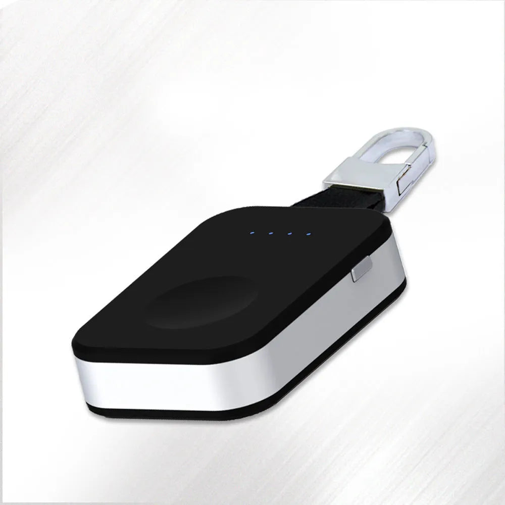 Black Apple Watch portable wireless charger keychain with keyring, shown next to an Apple Watch.
