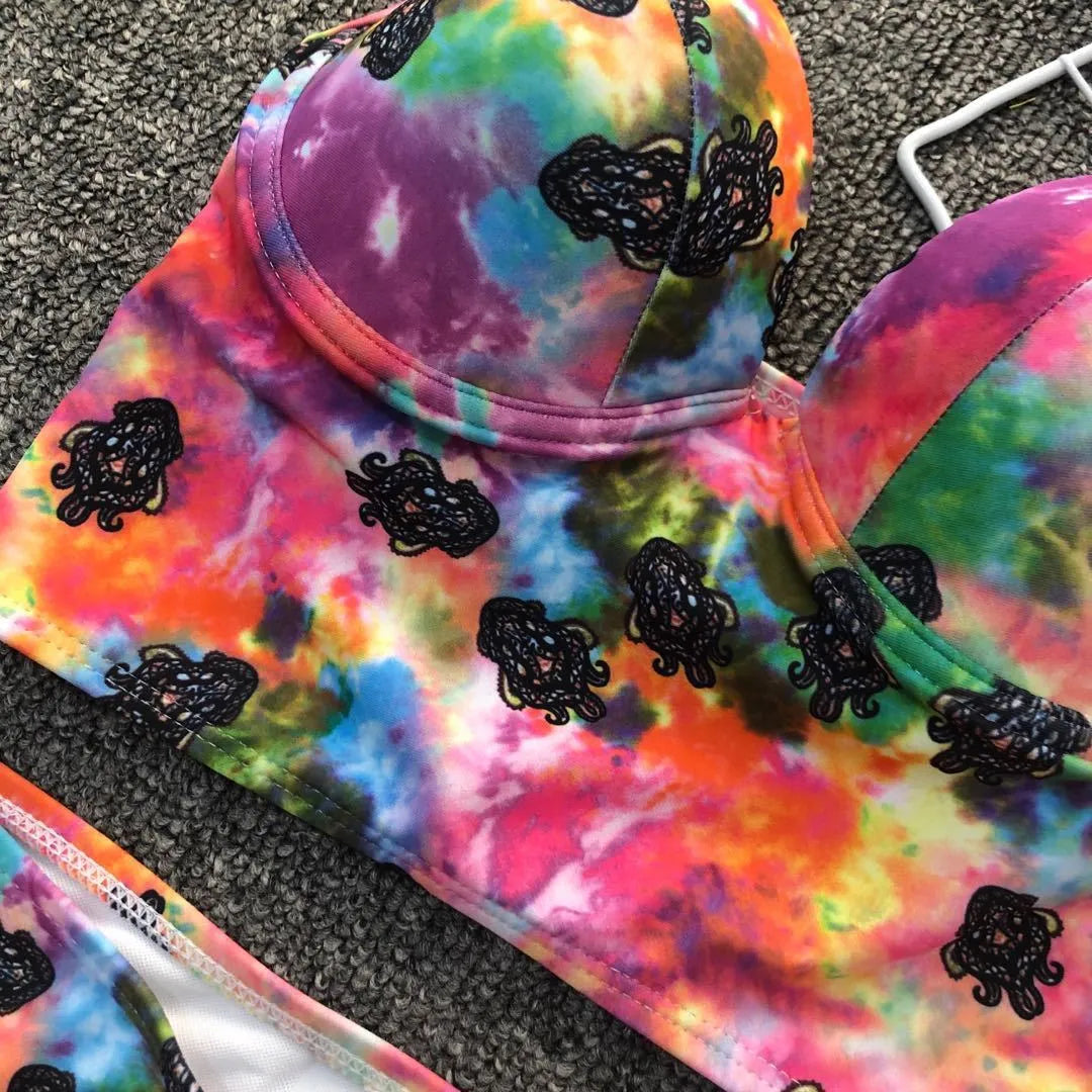 Pink gradient backless bikini swimsuit with chest pads on woman at beach