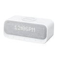 Anker Soundcore white or pink Bluetooth speaker alarm clock with wireless charging pad on top.