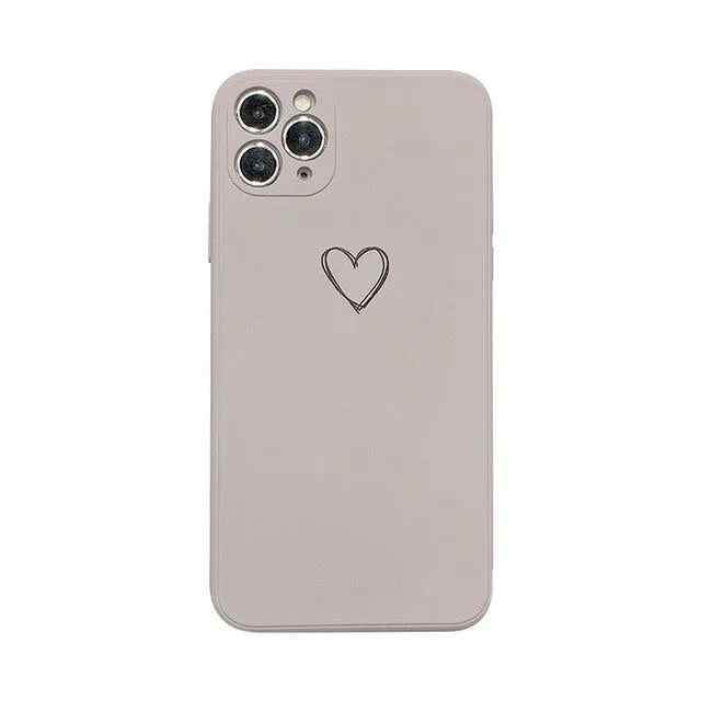 Solid colour silicone TPU back cover case for Apple iPhone on a table, showing colour options.