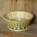 Handmade woven bamboo storage basket in natural colour showing three size variations