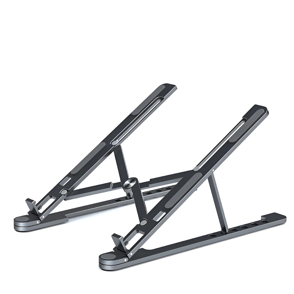 Portable aluminium laptop stand folded flat next to an open laptop showing its adjustable height.