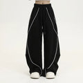 Black pleated wide-leg hip hop trousers with stripe pattern and mid waist cut