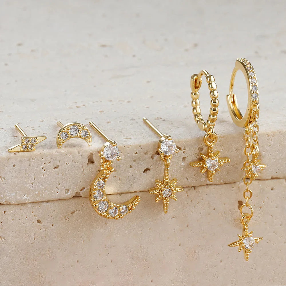Gold colour XINGX chain tassel earrings set with six pieces showing zircon stud details