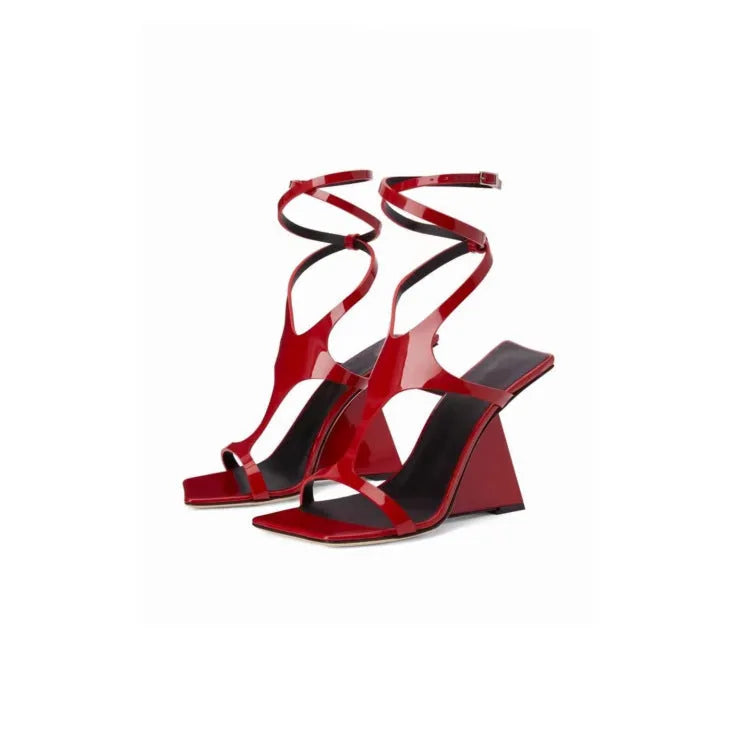 Women's black high heel sandals with a square toe and button fastening on a 9.5cm heel.