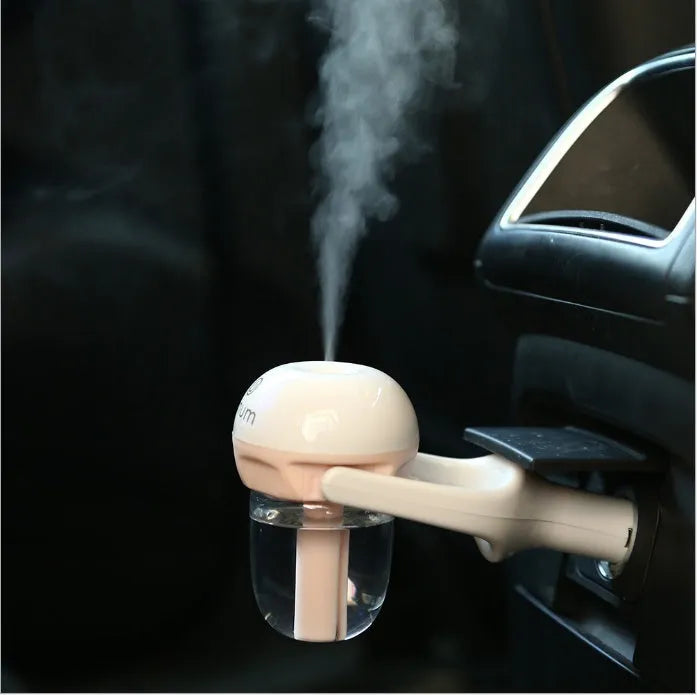 Compact blue car humidifier with essential oil diffuser function on car dashboard