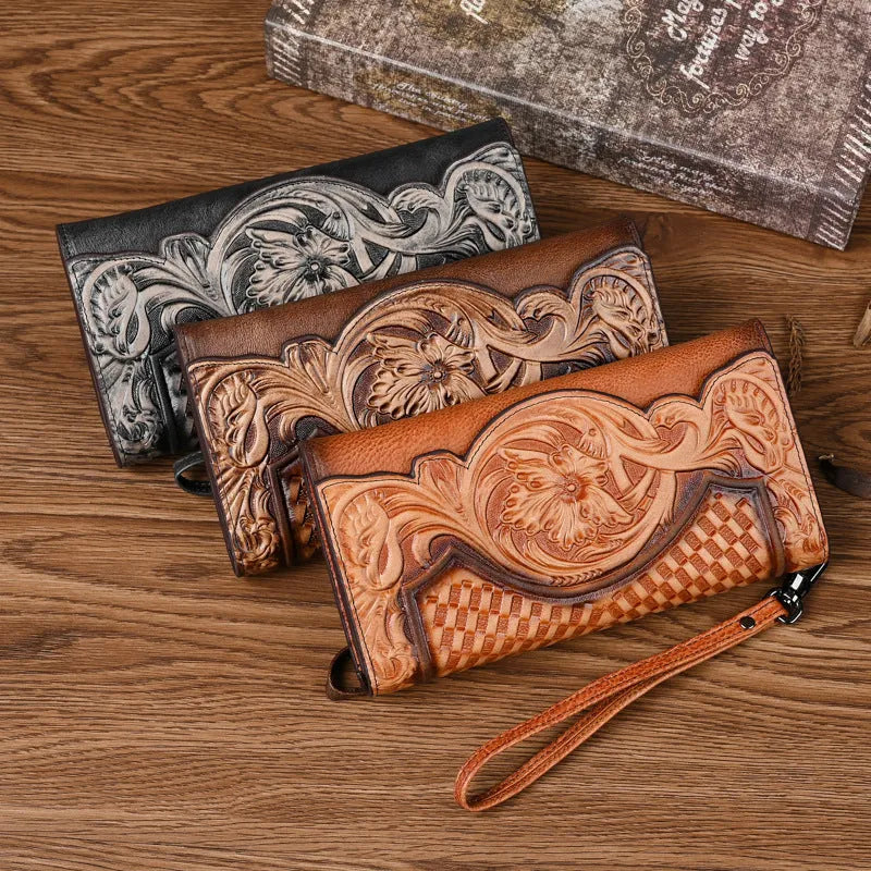 Women's brown leather tri-fold wallet with embossed Chinese floral pattern showing interior compartments