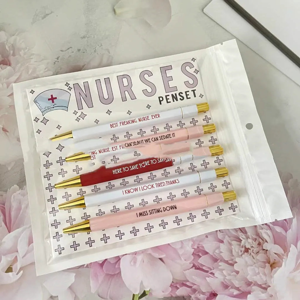 Set of five blue and white nurse-themed retractable ballpoint pens.