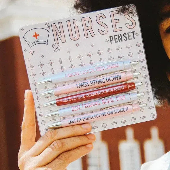 Set of five blue and white nurse-themed retractable ballpoint pens.