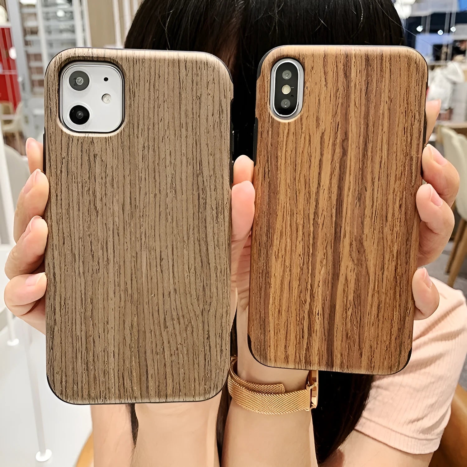 Wooden mobile phone case for iPhone showing natural bamboo grain and rosewood finishes