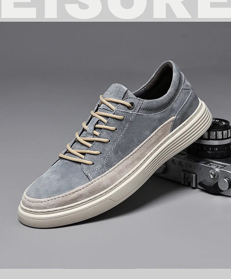 Men's grey casual skate shoes with pigskin leather upper and rubber sole, front lace-up closure