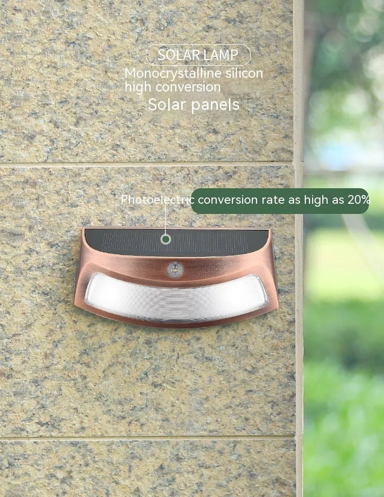 Solar garden wall light with smiley face design for outdoor courtyard illumination