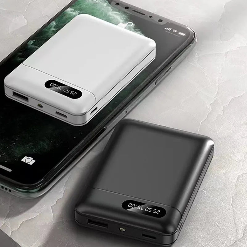 Black or white portable power bank with dual USB ports showing 10000mAh capacity