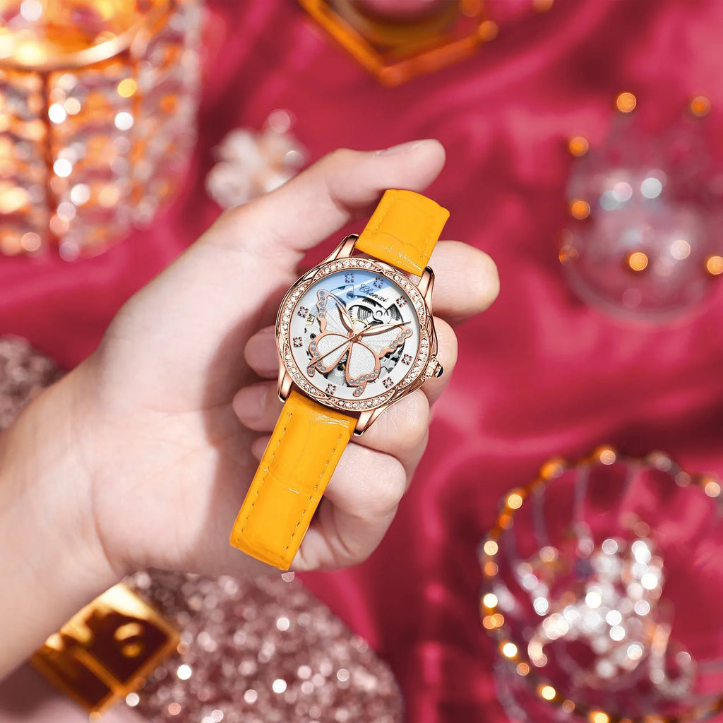 Butterfly dial diamond-embedded women's automatic mechanical watch with genuine leather strap and pin buckle on a white background