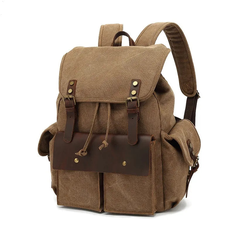 Retro canvas backpack in army green with antique bronze hardware showing dimensions and laptop compartment