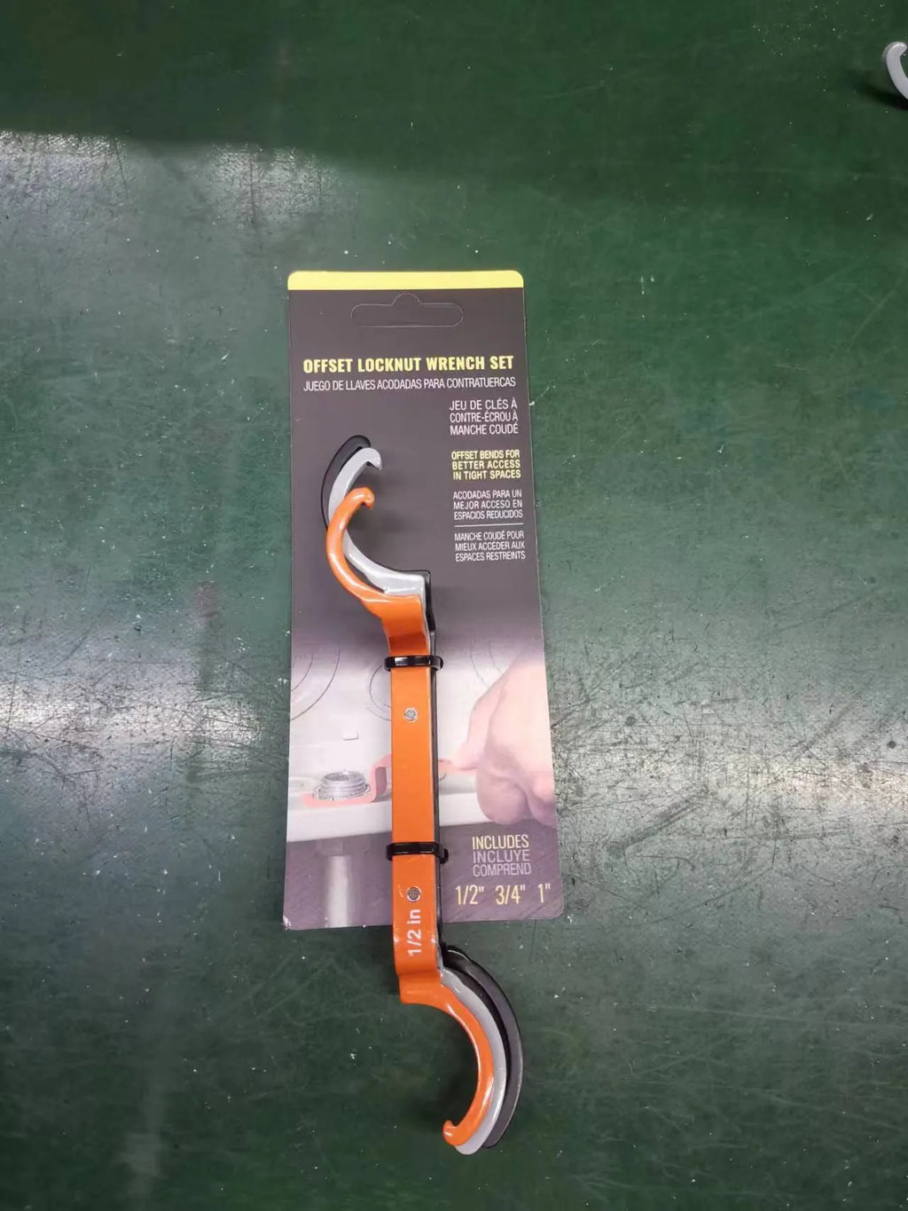 Orange, grey, and black magnetic crescent wrenches with catheter locking mechanism on one tool