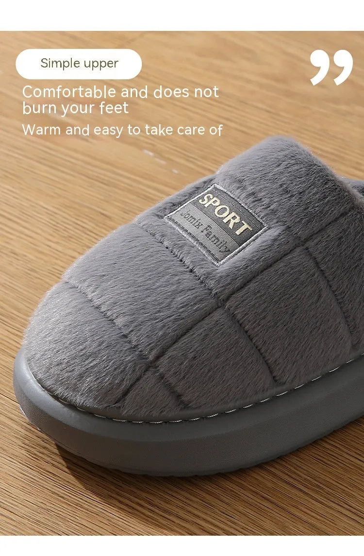 Men's grey and brown plaid rabbit hair winter slippers with a thick sole on a wooden floor.