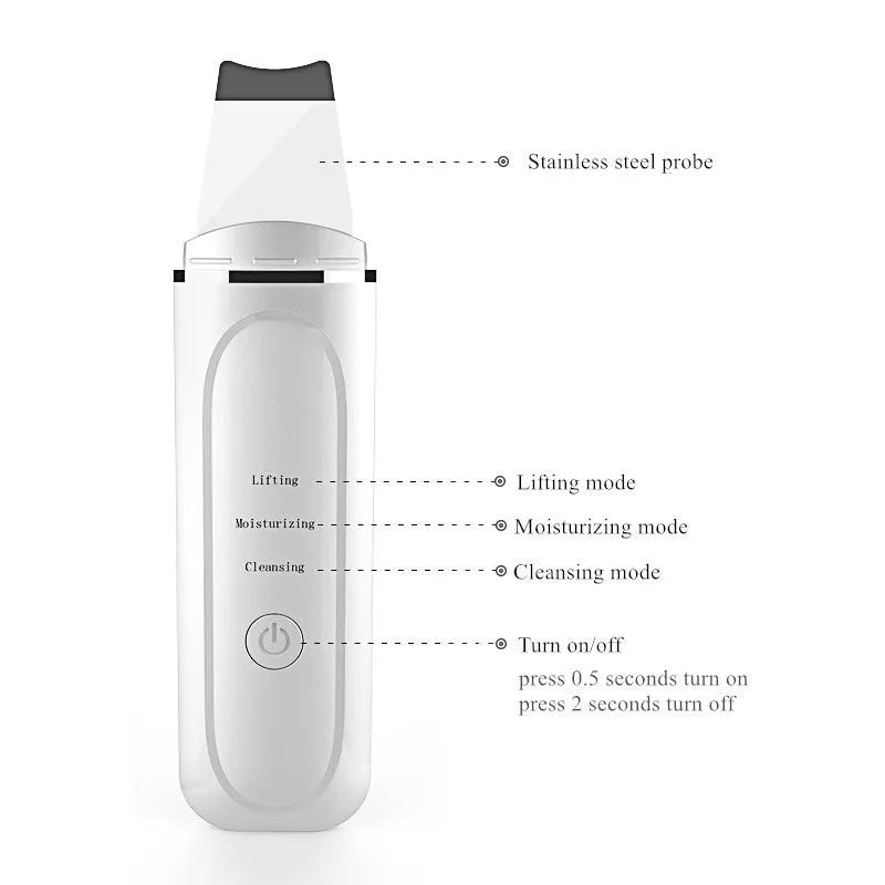 Pore cleansing facial device in golden finish with metal head, resting on a surface with USB cable