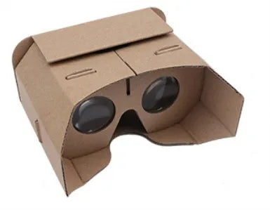 Corrugated paper virtual reality glasses headset for smartphones on a table.