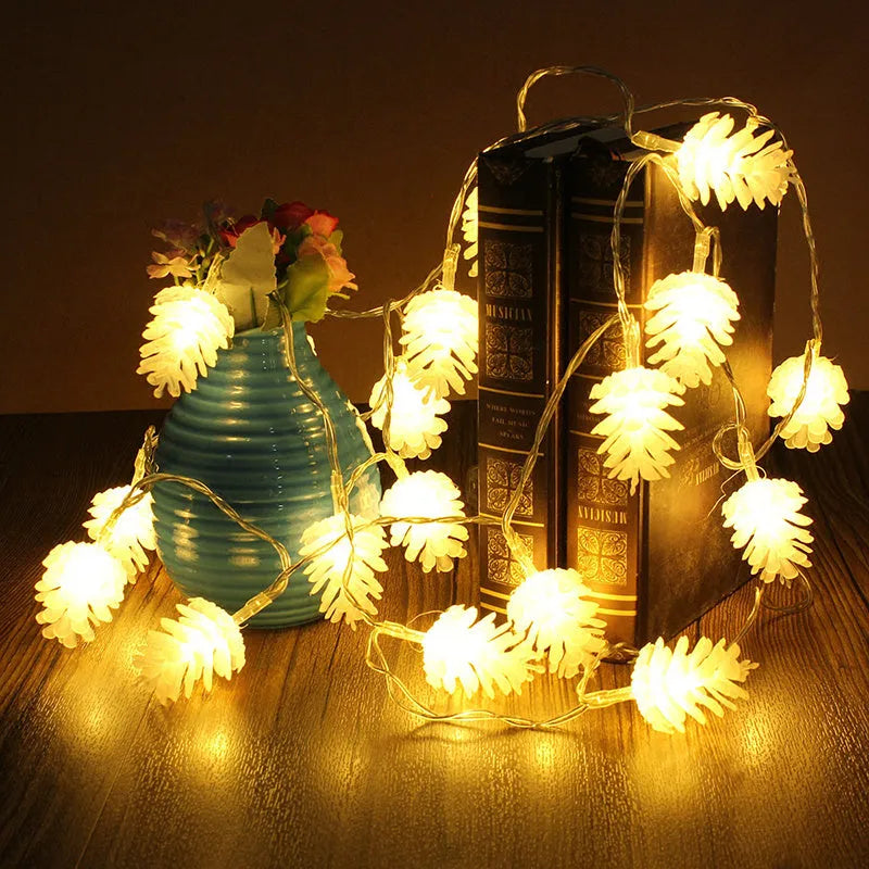 Warm white LED pine cone string lights with plastic shells in battery-powered decorative lighting