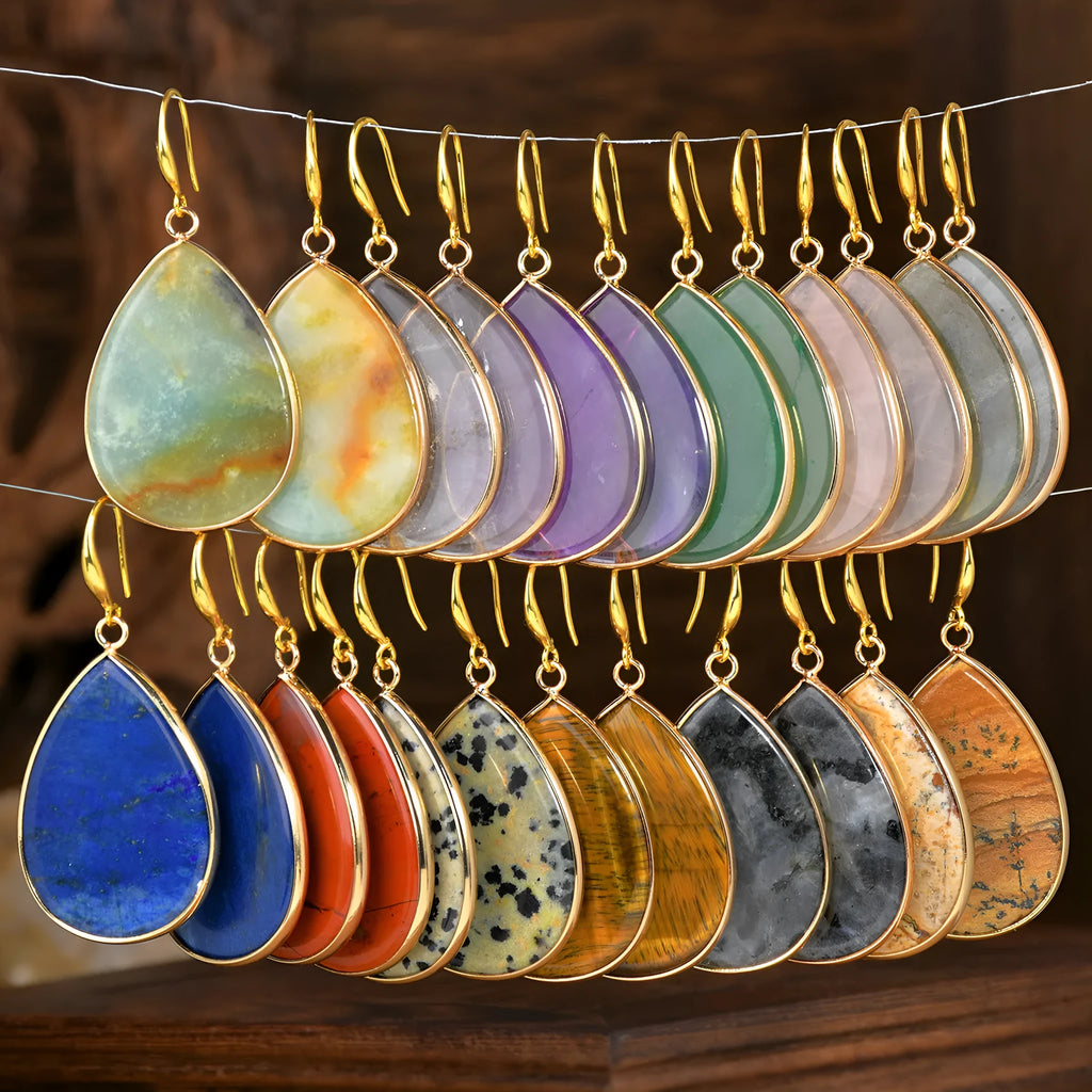 Women's silver-toned drop pendant earrings with a green aventurine stone, showing retro design and electroplated setting.