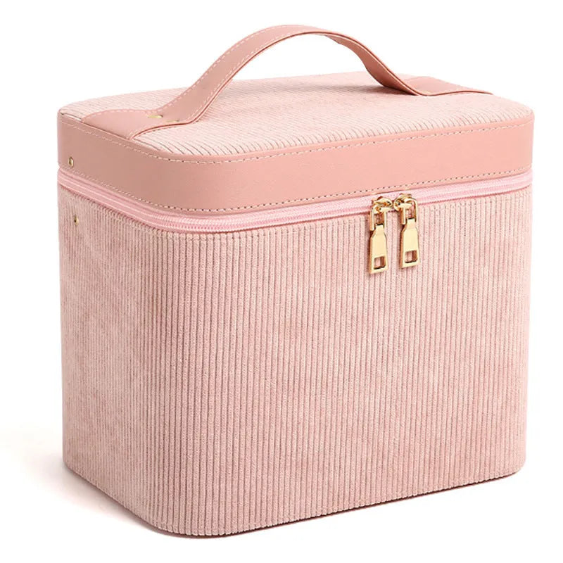 Corduroy cosmetic storage box in a solid colour with a lined interior.