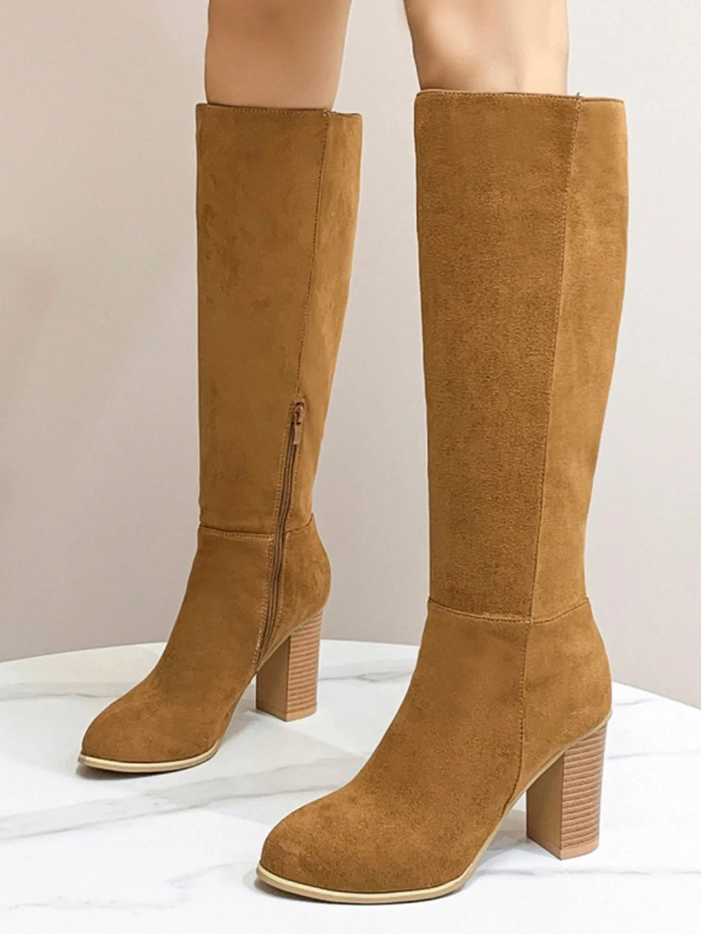 Women's black square toe high heel boots with artificial PU upper on wooden floor