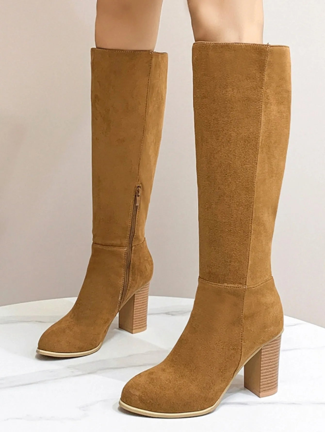 Women's black square toe high heel boots with artificial PU upper on wooden floor
