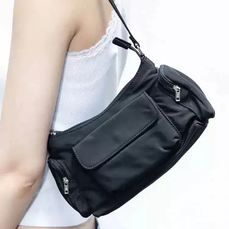 Black PU women's shoulder bag with side line detail, showing double pockets and measuring 24cm long.