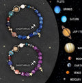 Set of two natural stone beaded bracelets with zodiac sign charms on a white background.