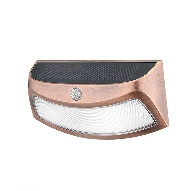 Solar garden wall light with smiley face design for outdoor courtyard illumination