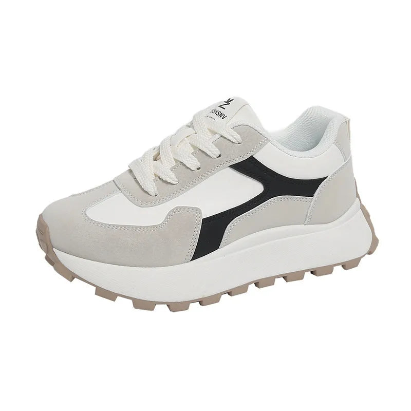 Women's solid colour platform sports shoes with lace-up front and flat rubber sole.